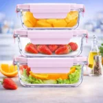 طقم علب ثلاجه زجاجية مكون من 3 قطع بأحجام مختلفة تحتوي على فواكه وخضروات طازجة.