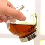 اختبار إحكام الغلق لـ برطمان بهارات زجاجي مملوء بالسائل دون تسريب