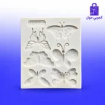 قالب سيليكون أبيض شكل فراشات متعدد التجاويف على خلفية زرقاء